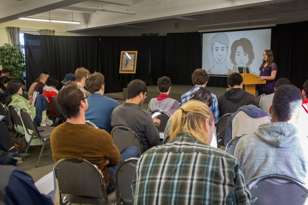 Participants receiving presentation from Crescentia DeGoede